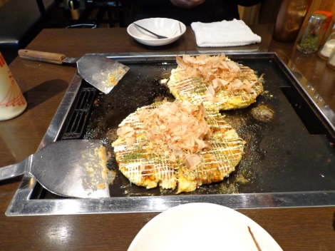 Okonomiyaki is kinda like a pancake, if a pancake had all sort of delicious ingredients attached to its boring recipe.